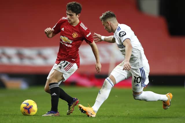 Dan James of Manchester United battles for possession with Ezgjan Alioski of Leeds United last December (Picture: Getty Images)