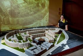 Catherine Robins project curator with a model ofd the Quarry Hill flats complex in Leeds, on show in a new exhibition being installed at Leeds City Museum celebrating 200 years of the Leeds Museums and Galleries service