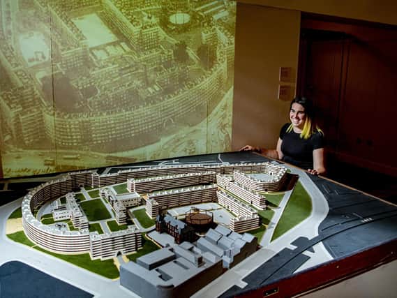Catherine Robins project curator with a model ofd the Quarry Hill flats complex in Leeds, on show in a new exhibition being installed at Leeds City Museum celebrating 200 years of the Leeds Museums and Galleries service