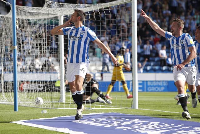 Matty Pearson of Huddersfield Town celebrates scoring with Harry Toffolo during the Sky Bet Championship match between Huddersfield Town and Reading at Kirklees Stadium (Picture: John Early/Getty Images)