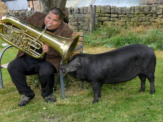 Lee Dunkley is a professional tuba player who also keeps pigs on his farm near Penistone