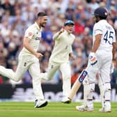 England's Chris Woakes celebrates taking the wicket of India's Rohit Sharma, caught by England's Jonny Bairstow. Pictures: PA.