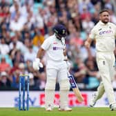 Not this time: England's Chris Woakes celebrates trapping India's Ajinkya Rahane for LBW only for it to be overturned after a review. Picture: PA