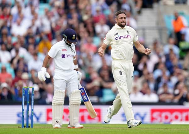 Not this time: England's Chris Woakes celebrates trapping India's Ajinkya Rahane for LBW only for it to be overturned after a review. Picture: PA