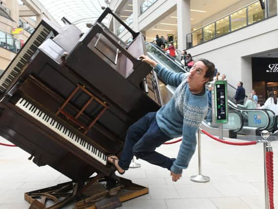 Artist Tim Vincent-Smith with The Piano Cube in Leeds Central Station
Photo: Gary Longbottom