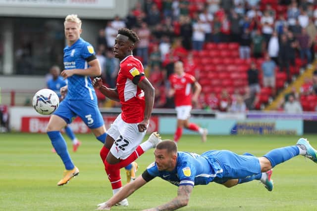 Barnsley's Clarke Oduor (left) and Birmingham City's Marc Roberts battle for the ball earlier this season (Picture: PA)