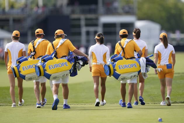 The European group of Celine Boutier, Georgia Hall, Leona Maguire, and Mel Reid walk to the green during practice for the Solheim Cup. (AP Photo/Carlos Osorio)