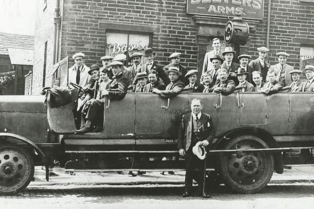 A pub trip out gets ready to head off from the Delvers Arms, Bradford, in the early 1920s.