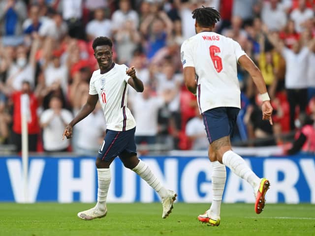 Bukayo Saka of England celebrates after scoring their team's fourth goal. (Photo by Shaun Botterill/Getty Images)