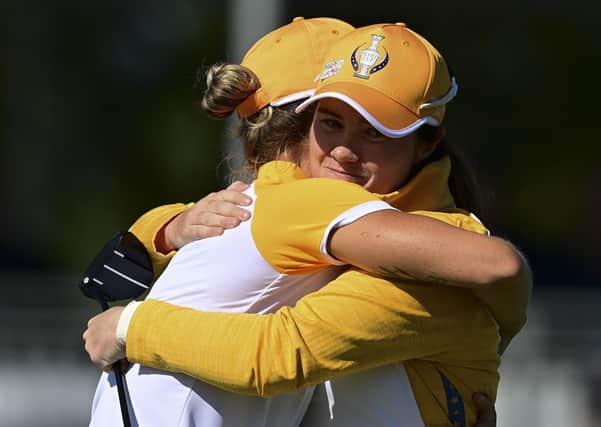 Europe's Leona Maguire and Mel Reid celebrate their win against the United States on the 14th hole during the foursome matches. (AP Photo/David Dermer).