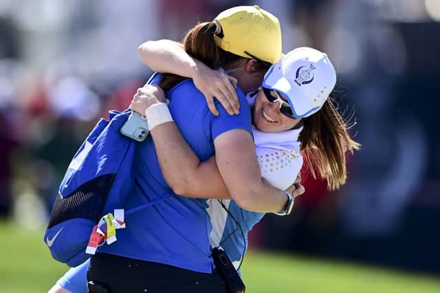 Europe's Leona Maguire celebrates with her sister Lisa after defeating United States' Jennifer Kupcho on the 15th hole. (AP Photo/David Dermer)