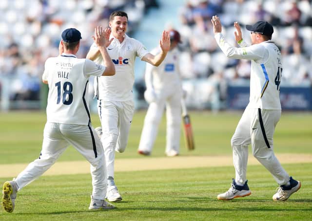 Yorkshire's Matt Fisher celebrates the wicket of Somerset's Azhar Ali with teammates George Hill and Dom Bess. Pictures: Will Palmer/SWpix.com