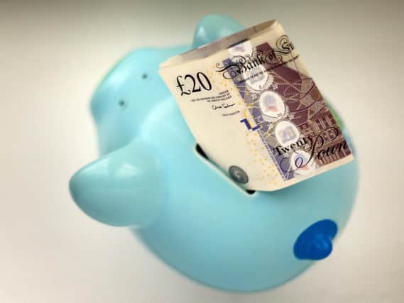 File photo dated 06/01/15 of money in a piggy bank. (PA/ Gareth Fuller)