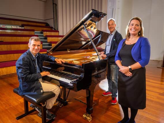 Ulrich Gerhartz, Director Concert & Artist Services for Steinway & Sons, with Adam Gatehouse, Artistic Director, for The Leeds International Piano Competition, and Fiona Sinclair, Chief Executive Officer of The Leeds International Piano Competition, on stage at the Great Hall of Leeds Univeristy in preparation for the start of the competition
Photo: James Hardisty
