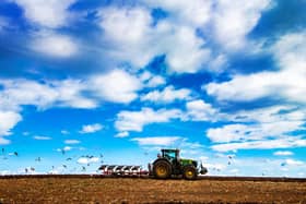 A farmer using an agriculture tractor ploughing a field near Garforth, West Yorkshire. Picture: James Hardisty