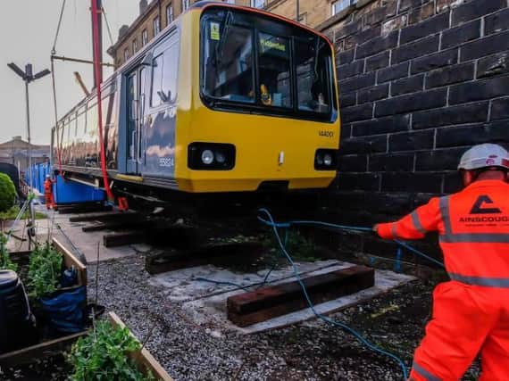 One of the 19-tonne carriages is being used by Huddersfield-based mental health charity Platform 1 as an educational kitchen for cookery courses