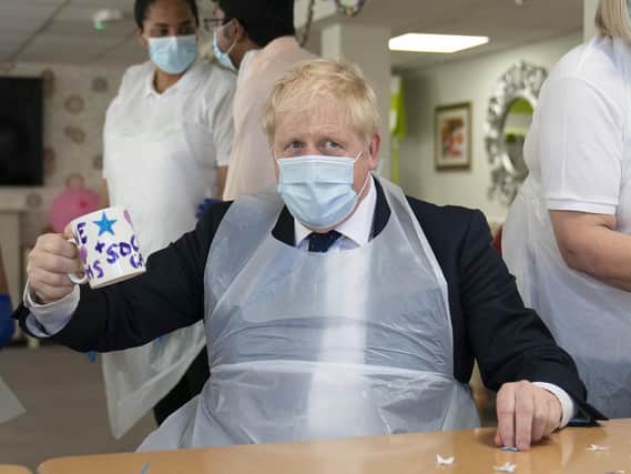 Prime Minister Boris Johnson during a visit to Westport Care Home in Stepney Green, east London, ahead of unveiling his long-awaited plan to fix the broken social care system (Paul Edwards/The Sun)