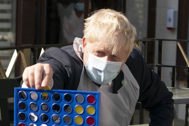 Prime Minister Boris Johnson during a visit to Westport Care Home in Stepney Green, east London, ahead of unveiling his long-awaited plan to fix the broken social care system.