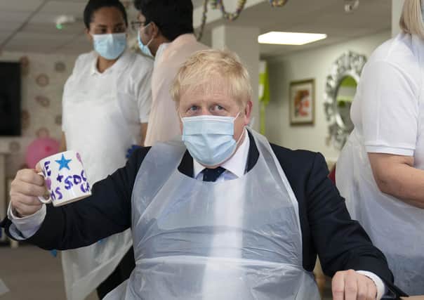 Prime Minister Boris Johnson during a visit to Westport Care Home in Stepney Green, east London, ahead of unveiling his long-awaited plan to fix the broken social care system.