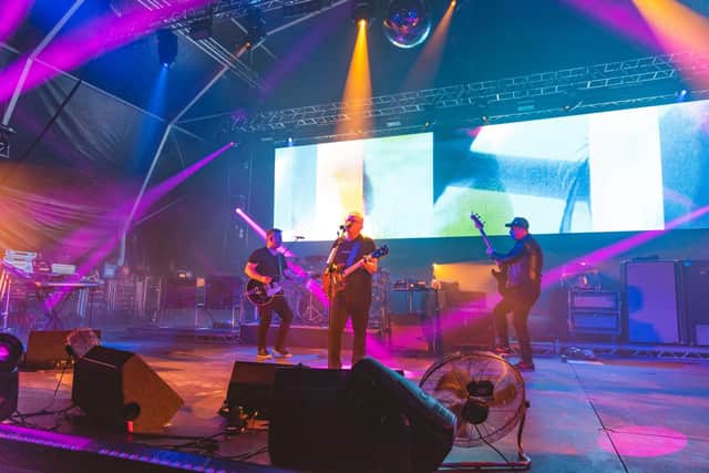 New Order onstage at Halifax Piece Hall. Picture: The Piece Hall