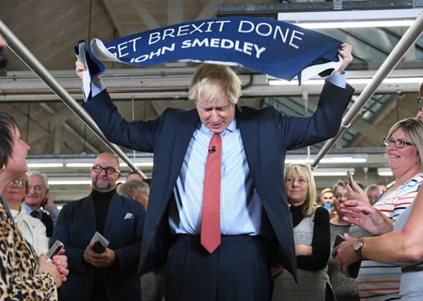 Boris Johnson with a Get Brexit Done banner during the 2019 election.