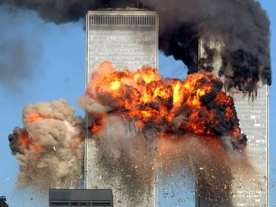 Hijacked United Airlines Flight 175 from Boston crashes into the south tower of the World Trade Center and explodes at 9:03 a.m. on September 11, 2001 in New York City. Photo by Spencer Platt/Getty Images.