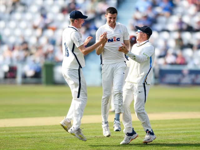 CAREER-BEST: Yorkshire's Matt Fisher celebrates the wicket of Somersets Azhar Ali with team-mates George Hill and Dom Bess Picture by Will Palmer/SWpix.com