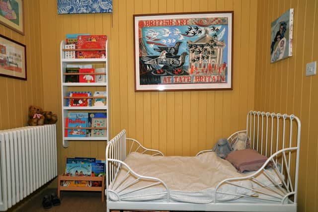 The children's bedroom featuring a print by Mark Hearld