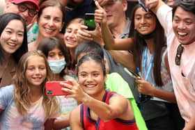 Teenager Emma Raducanu takes selfies with fans at the US Open. (Picture: Matthew Stockman/Getty Images)