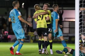 Harrogate Town's Luke Armstrong (left) celebrates with Jack Diamond after scoring their side's second goal. Picture: PA