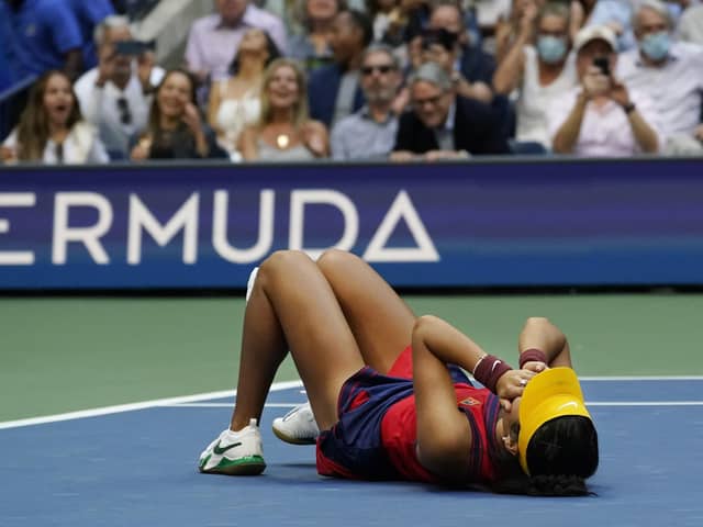 Emma Raducanu collapses to the floor after defeating Leylah Fernandez in the US Open women's singles final in New York on Saturday night. Picture: AP/Elise Amendola