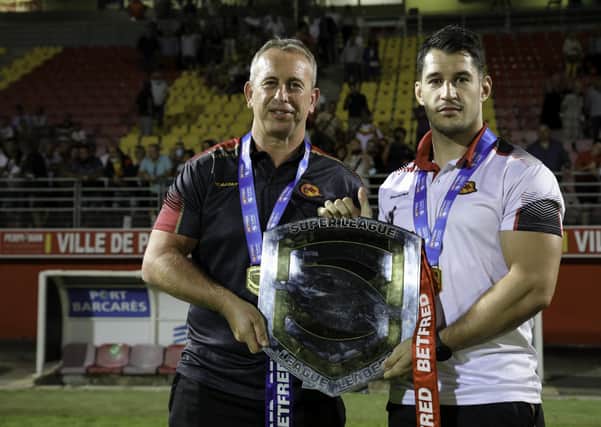 History men: Catalan Dragons' coach Steve McNamara and Benjamin Garcia with the Betfred League Leader's Shield. Picture by Laurent Selles/Catalan Dragons/SWpix.com