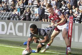 Strong arm: Hull FC’s Mitieli Vulikijapani and the home fans thought he had scored a try but Wigan’s Ethan Havard had other ideas in the 10-0 defeat.Picture: Dean Atkins/SWpix.com