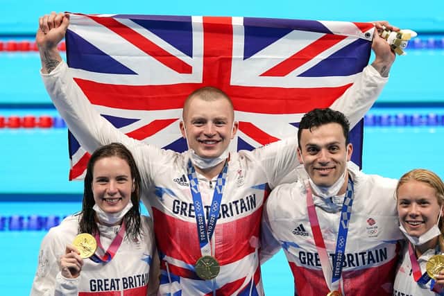 Great Britain's Kathleen Dawson, Adam Peaty, James Guy, and Anna Hopkin with their Gold medals for the Mixed 4 x 100m medley relay.