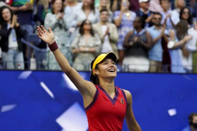 Emma Raducanu, of Britain, waves to the crowd after defeating Leylah Fernandez in New York. (AP Photo/Seth Wenig)