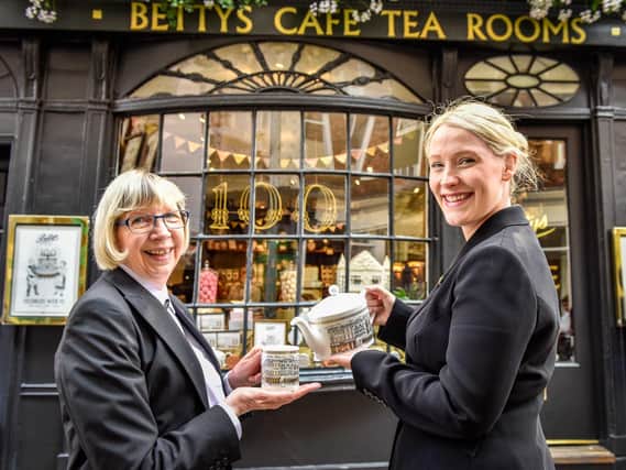 Long-serving Little Bettys staff member Pam Broadbent and branch manager Sarah Barnacle on the 100th anniversary of Bettys in 2019
