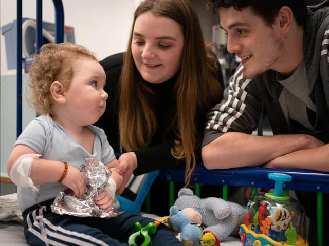 Rosie-Mae Walton and Wes Powell with their son Marley as he recovers at Sheffield Children's Hospital
