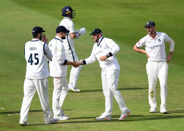 Warwickshire's Tim Bresnan celebrates catching out Yorkshire's Jordan Thompson with team-mate Will Rhodes. Picture: Will Palmer/SWpix.com