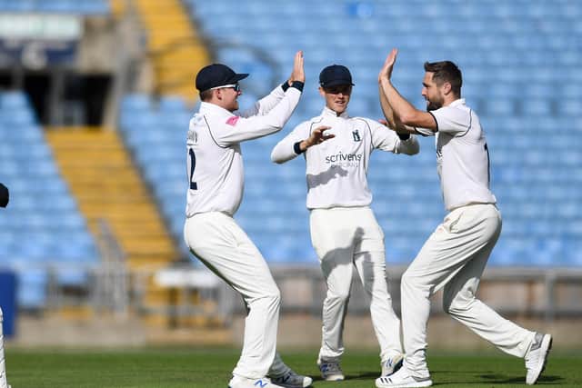 Warwickshire's Chris Woakes celebrate the wicket of Yorkshire's Gary Ballance with team-mate Chris Benjamin. Picture: Will Palmer/SWpix.com