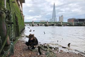 Ruth Claydon looks for treasures on the shores of the River Thames in London,
