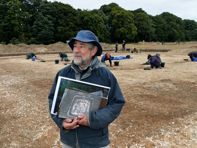 Dr Peter Halkon, Senior Lecturer in Archaeology at the University of Hull, at the "shrine" site - those in the background are working on an entranceway to the fort