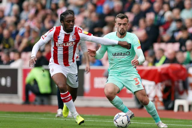 Stoke City's Romaine Sawyers and Huddersfield Town's Harry Toffolo battle for the ball (Picture: PA)