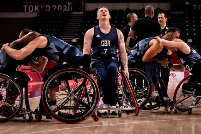 Relief: Britain's Terry Bywater (C) closes his eyes after his team won the wheelchair basketball men's bronze medal match . (Picture: YASUYOSHI CHIBA/AFP via Getty Images)