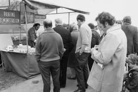.A weights and measures inspector makes notes at Pocklington's market in 1973.