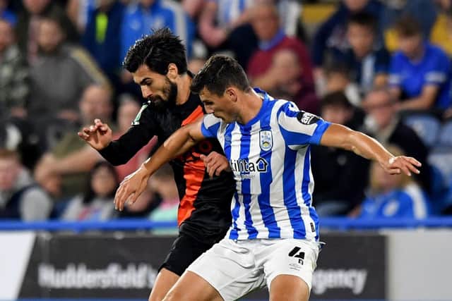 Everton's Andre Gomes battles with Huddersfield Town's Matty Pearson (Picture: PA)