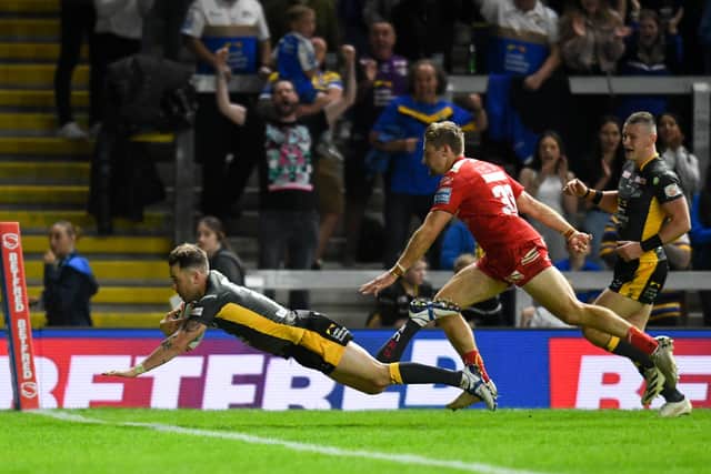 Diving in: Richie Myler of Leeds Rhinos dives to score his side's fourth try against Hull KR. Picture by Will Palmer/SWpix.com