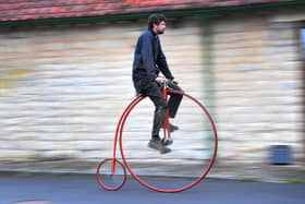Penny Farthing maker Christian Richards, pictured on one of the cycles he has built, Image: Simon Hulme.