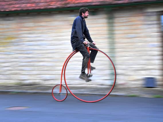 Penny Farthing maker Christian Richards, pictured on one of the cycles he has built, Image: Simon Hulme.
