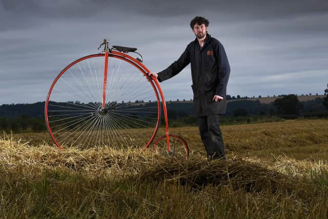 Penny Farthing maker Christian Richards, pictured with one of the cycles he has built, Image: Simon Hulme.