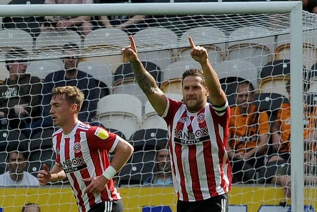 Milestone marked: Billy Sharp reels away in celebration after scoring for Sheffield United in the win at Hull City (Picture: Simon Hulme)